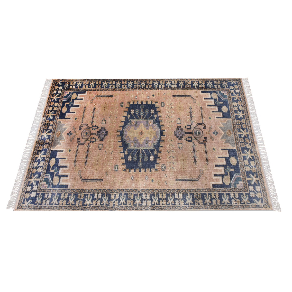 Darbar hand-knotted wool rug with rust and navy Anatolian medallions, in a living room