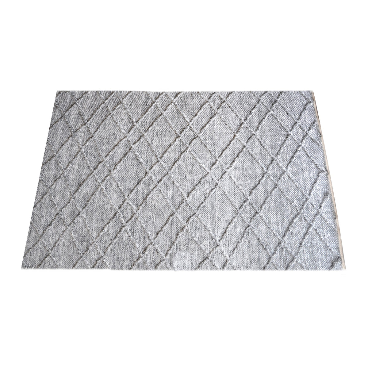 Razai handwoven recycled PET rug with a taupe diamond-quilted raised weave, on a patio