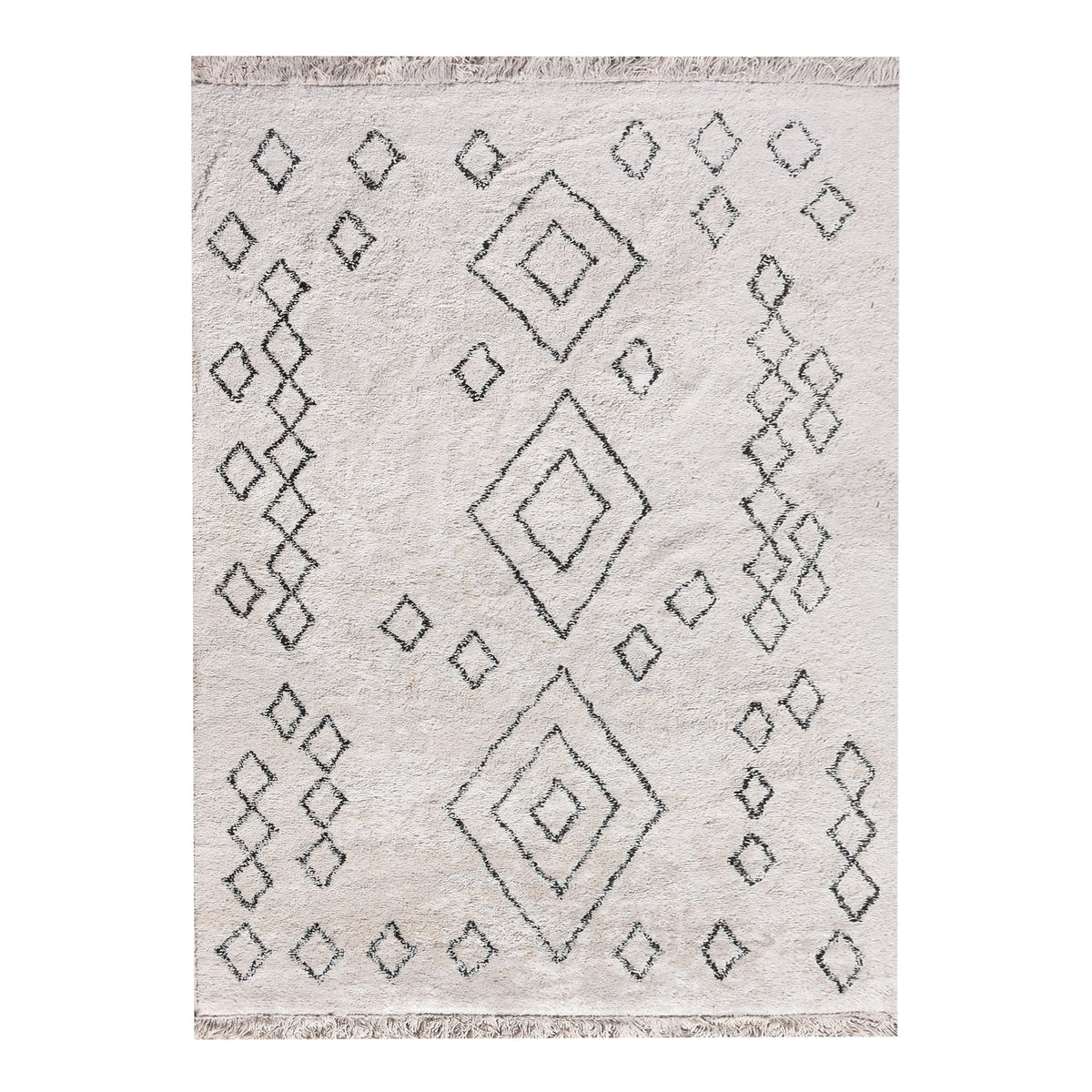Chhapa tufted cotton rug with black diamonds and chevron borders on bone white, in a study