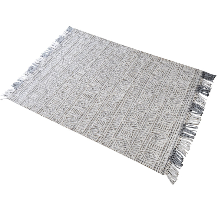 Baoli handwoven recycled PET rug with chunky ivory and grey tribal geometry, in an entryway