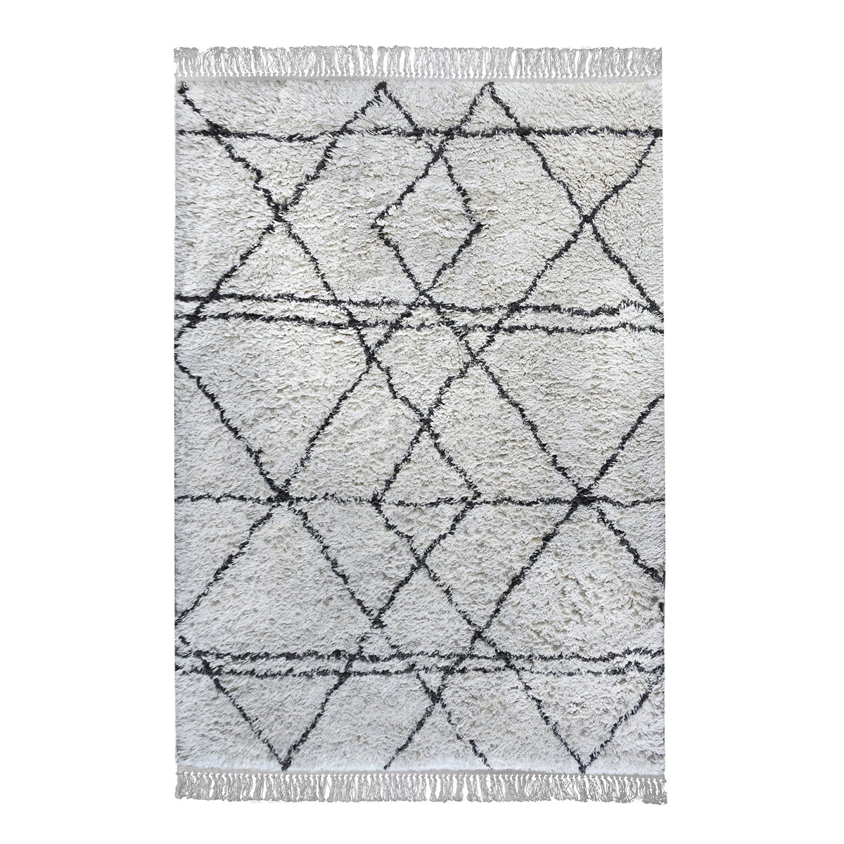 Lipi tufted cotton shag rug in ivory with a bold black lattice, in a bedroom