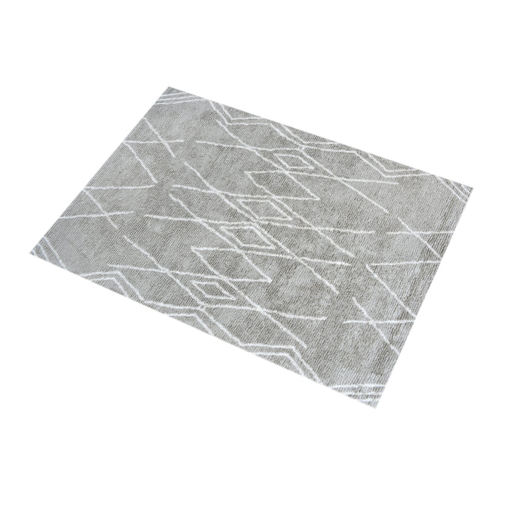 Jugnu tufted cotton and viscose rug with ivory diamond lines on silver grey, in a bedroom