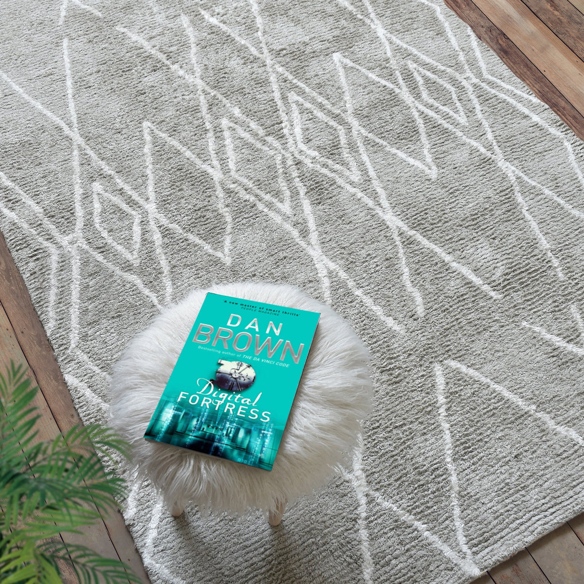 Jugnu tufted cotton and viscose rug with ivory diamond lines on silver grey, in a bedroom