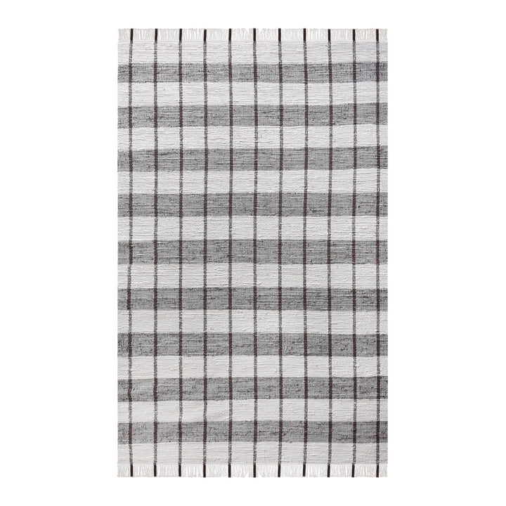 Gamcha handwoven recycled denim flatweave rug with a charcoal-grey and ivory buffalo check, in a living room