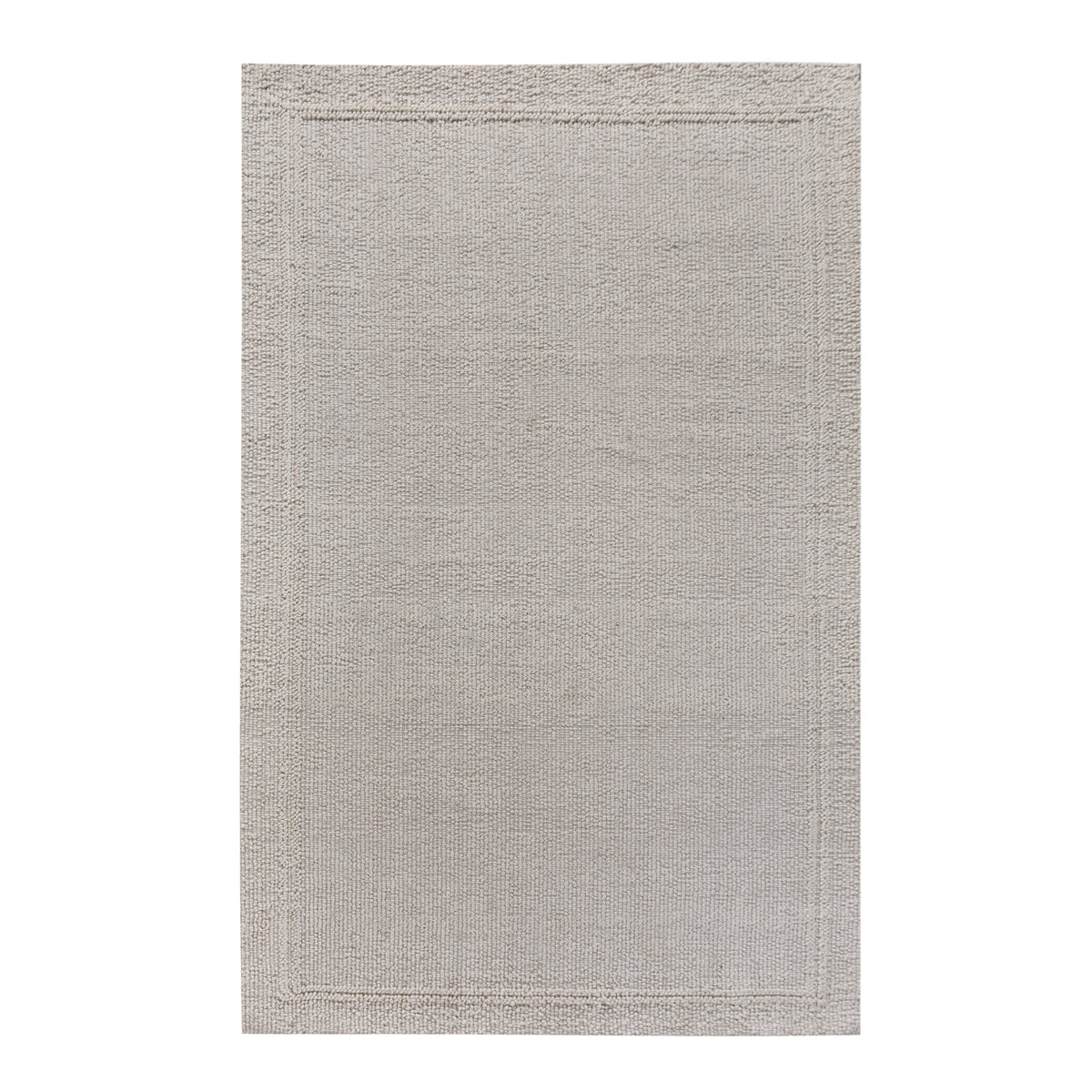 Linen handwoven wool rug in plain cream with a tonal border, in a bedroom