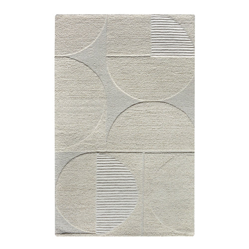 Archway handwoven ivory wool rug with carved arc lines, in a living room
