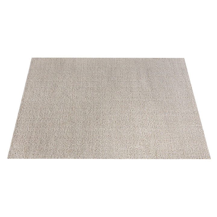 Lakeer handwoven ridged wool rug in oatmeal, tone on tone, in a bedroom