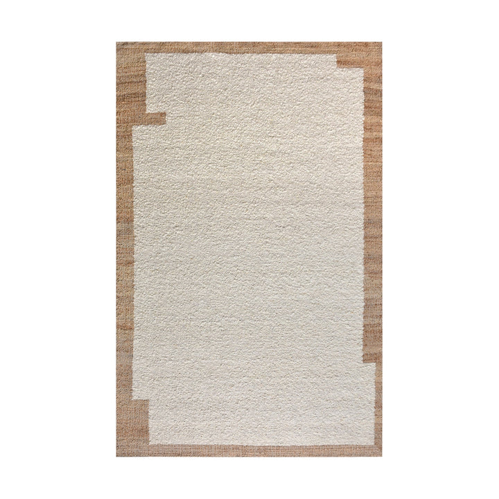 Kinari handwoven wool and jute rug in pale ivory with plain ribs and a tonal border, in a living room