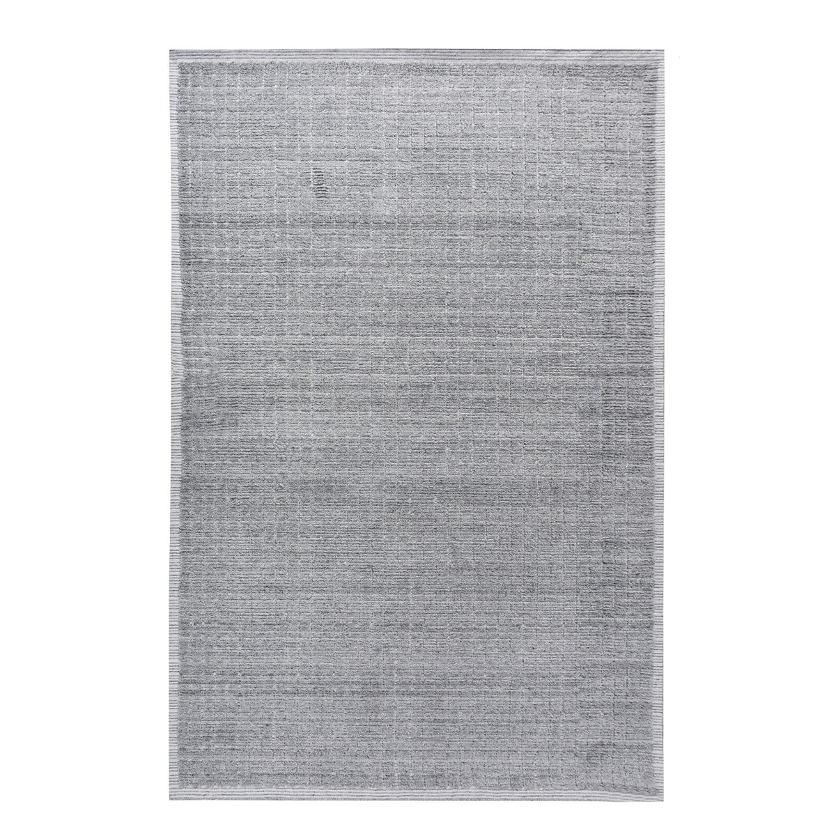 Raakh handwoven flatweave recycled PET rug in plain heather grey with fringe, in a living room