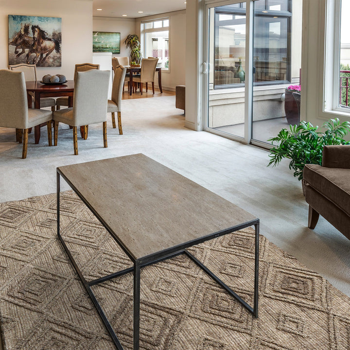 Jaali handwoven oatmeal wool rug with raised ivory diamond lattice, in a living room