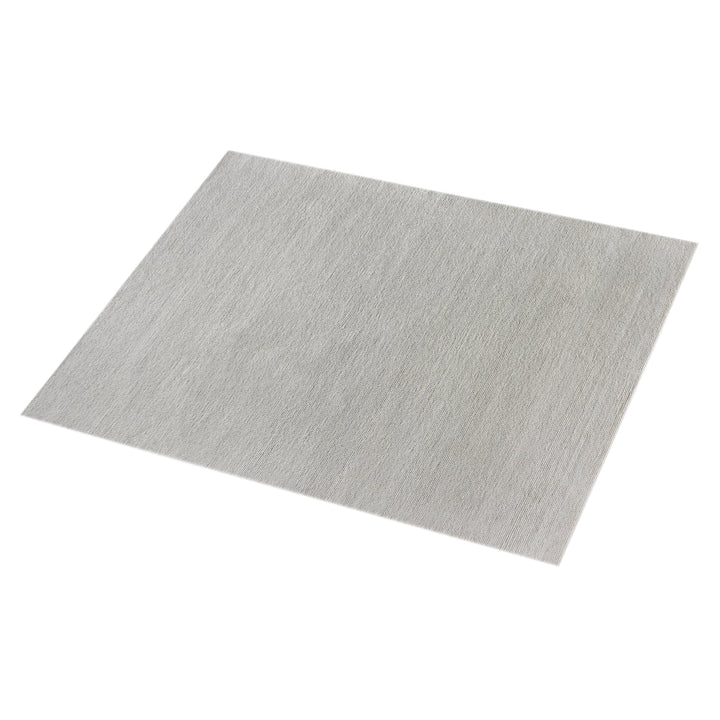 Mist handwoven pale stone wool rug with a chunky looped weave, in a living room